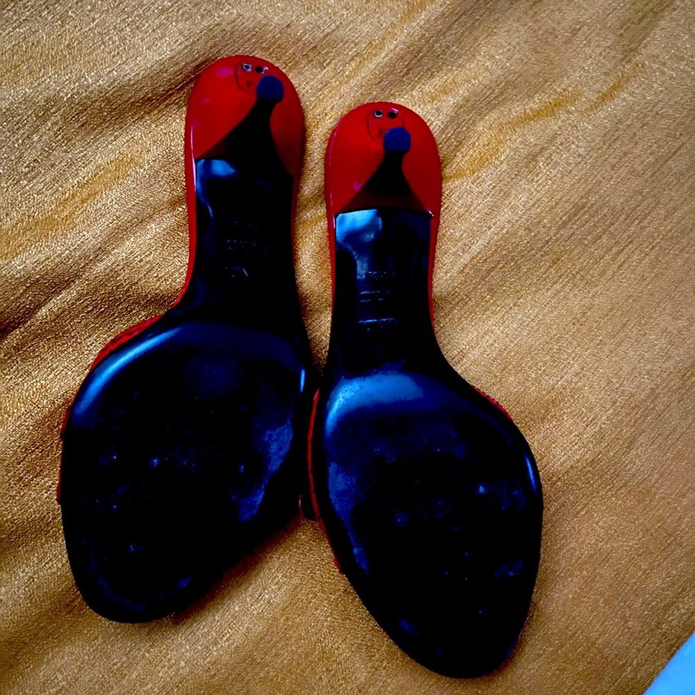 Red FENDI sandals with kitty heel.